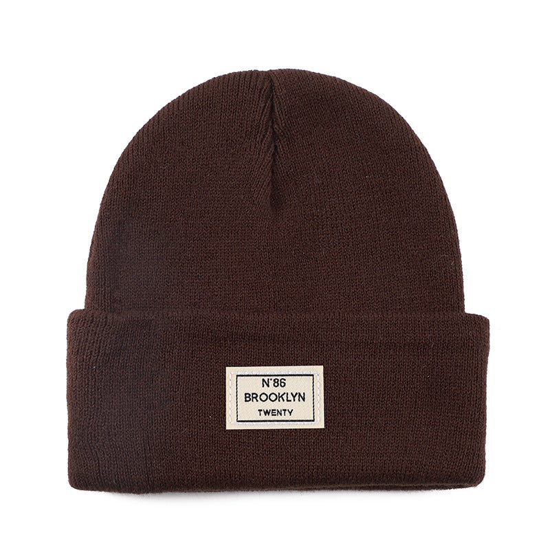 Knitted Beanie With Brand Label Stylish And Fashionable