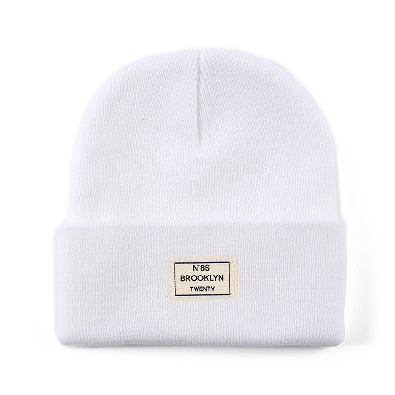 Knitted Beanie With Brand Label Stylish And Fashionable