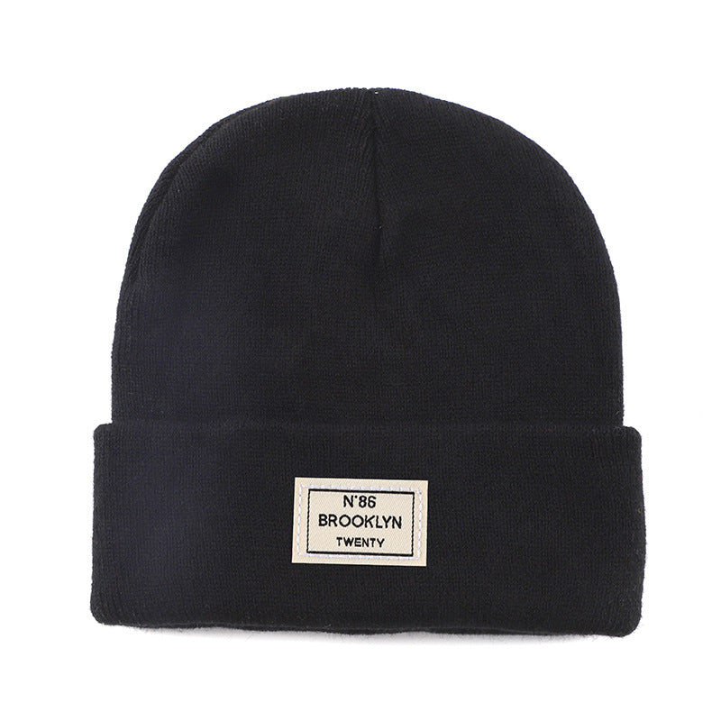 Knitted Beanie With Brand Label Stylish And Fashionable