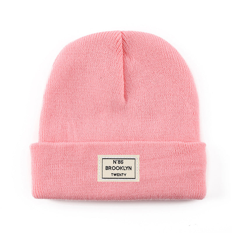 Knitted Beanie With Brand Label Stylish And Fashionable