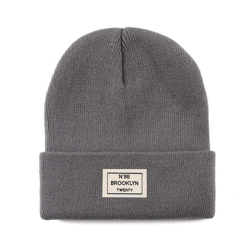 Knitted Beanie With Brand Label Stylish And Fashionable